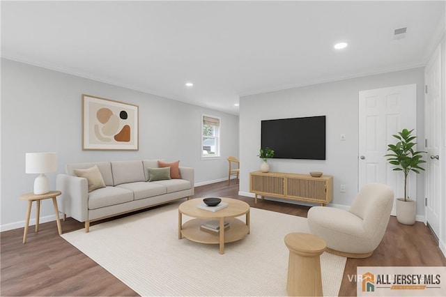 1092 Woodruff St, Iselin, NJ 08830 - living room featuring wood finished floors, ornamental molding, recessed lighting, and baseboards