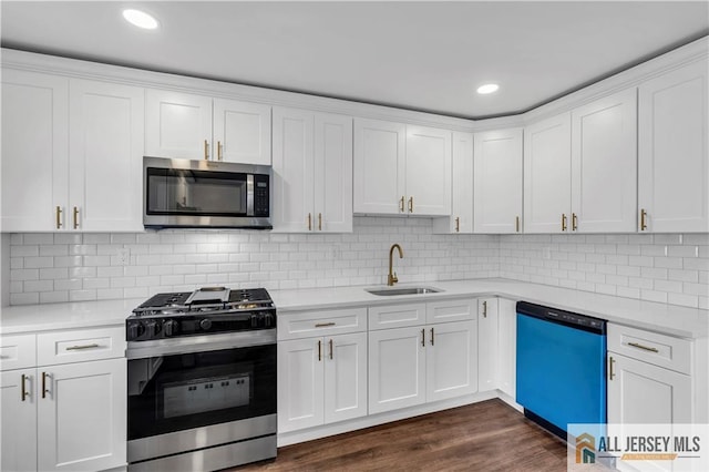 1092 Woodruff St, Iselin, NJ 08830 - kitchen with stainless steel microwave, gas range oven, dishwasher, a sink, and light countertops