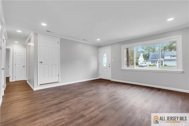1092 Woodruff St, Iselin, NJ 08830 - foyer entrance with ornamental molding, dark wood finished floors, baseboards, and recessed lighting