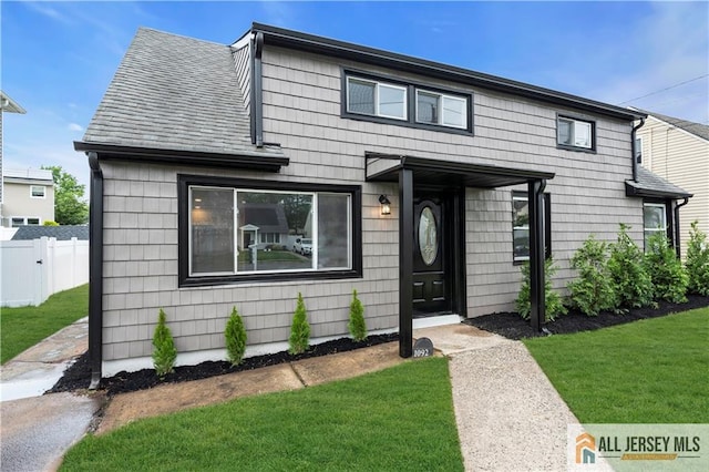 1092 Woodruff St, Iselin, NJ 08830 - view of front of property featuring roof with shingles