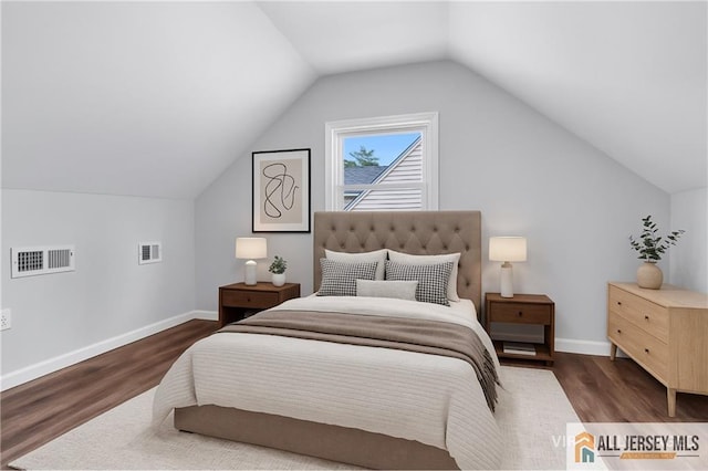 1092 Woodruff St, Iselin, NJ 08830 - bedroom featuring wood finished floors, vaulted ceiling, and baseboards