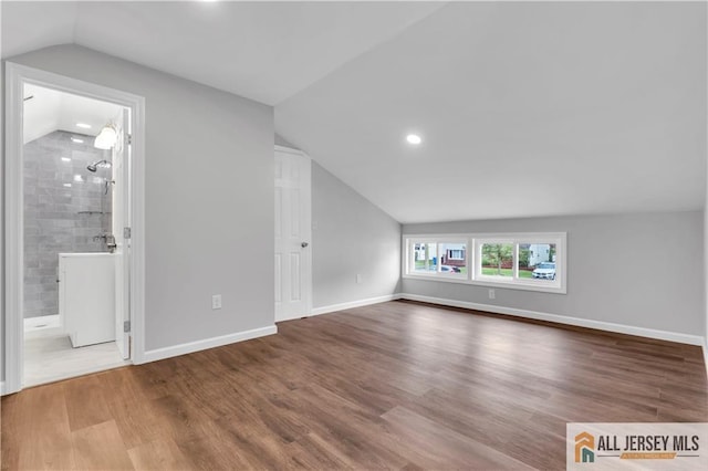 1092 Woodruff St, Iselin, NJ 08830 - bonus room featuring lofted ceiling, recessed lighting, wood finished floors, and baseboards