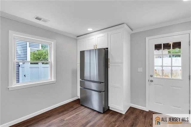 1092 Woodruff St, Iselin, NJ 08830 - kitchen featuring freestanding refrigerator, baseboards, dark wood finished floors, ornamental molding, and white cabinets