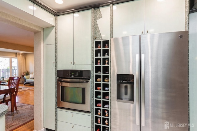 kitchen featuring wood finished floors and stainless steel appliances