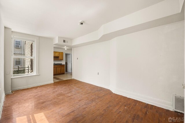 unfurnished living room featuring light hardwood / wood-style floors