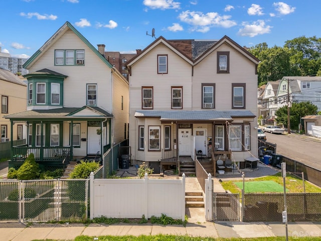 view of front of house featuring a porch and central air condition unit