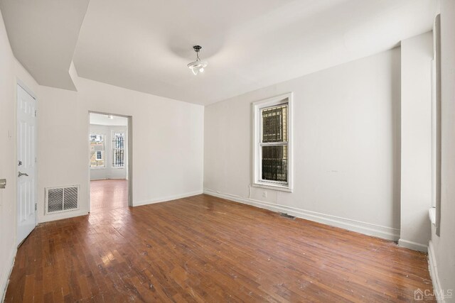 empty room featuring hardwood / wood-style floors