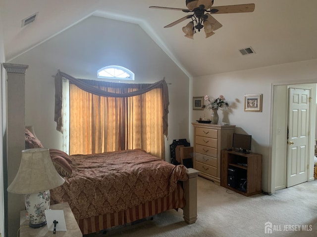 bedroom featuring high vaulted ceiling, visible vents, ceiling fan, and light carpet