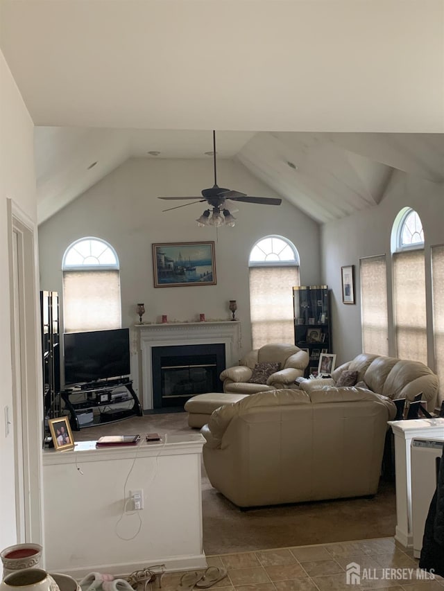 54 Mcfarlane Cir, Monroe, NJ 08831 - living room featuring a glass covered fireplace, ceiling fan, and vaulted ceiling