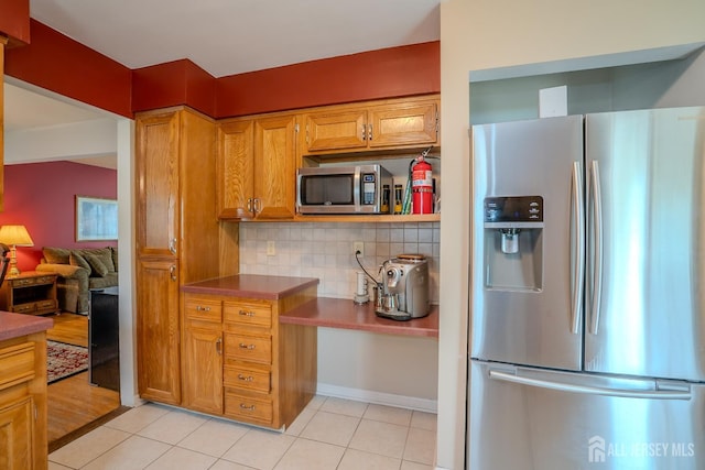 5 Wetherhill Way S, Brunswick, NJ 08810 - kitchen with stainless steel appliances, decorative backsplash, light tile patterned flooring, and brown cabinetry