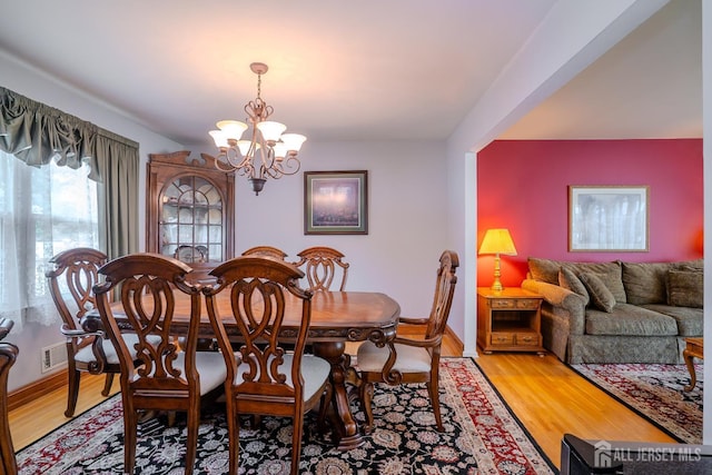 5 Wetherhill Way S, Brunswick, NJ 08810 - dining room with a chandelier, light wood-style flooring, and baseboards