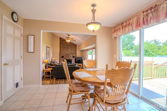 5 Wetherhill Way S, Brunswick, NJ 08810 - dining space with a brick fireplace, light tile patterned flooring, ceiling fan, lofted ceiling, and baseboards