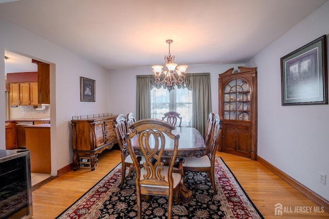 5 Wetherhill Way S, Brunswick, NJ 08810 - dining room with wine cooler, a chandelier, light wood-type flooring, and baseboards