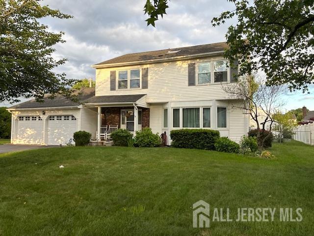 5 Wetherhill Way S, Brunswick, NJ 08810 - traditional-style home featuring a porch, an attached garage, and driveway