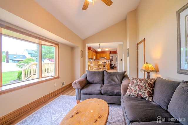 5 Wetherhill Way S, Brunswick, NJ 08810 - living area featuring light wood-style floors, vaulted ceiling, ceiling fan, and baseboards