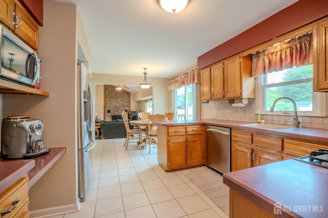 5 Wetherhill Way S, Brunswick, NJ 08810 - kitchen featuring stainless steel appliances, a peninsula, tasteful backsplash, light tile patterned floors, and a sink