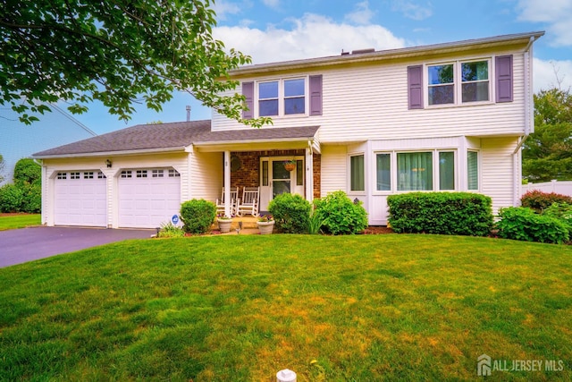 5 Wetherhill Way S, Brunswick, NJ 08810 - view of front facade featuring an attached garage, a front lawn, and asphalt driveway
