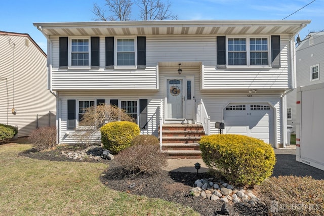 bi-level home featuring a garage