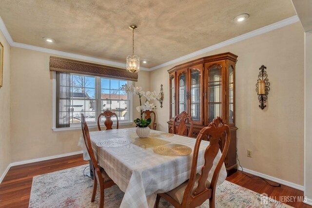 dining room with recessed lighting, a chandelier, wood finished floors, and baseboards