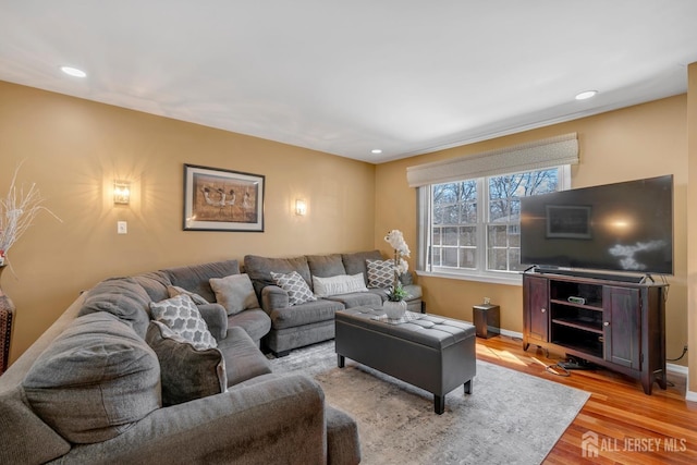 living area featuring wood finished floors, recessed lighting, and baseboards