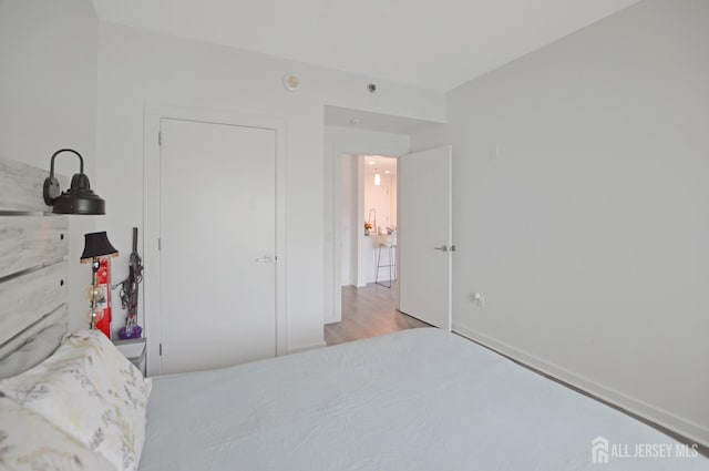 1 Carriage City Plz Unit 509, Rahway, NJ 07065 - bedroom featuring wood finished floors and baseboards