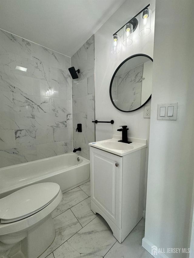 full bathroom with vanity, toilet, and tiled shower / bath