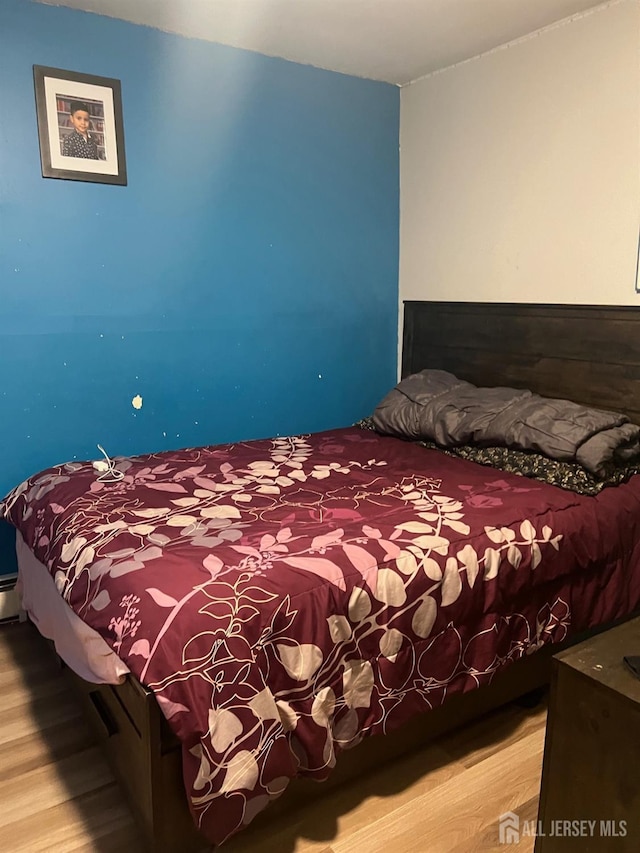 bedroom featuring hardwood / wood-style flooring