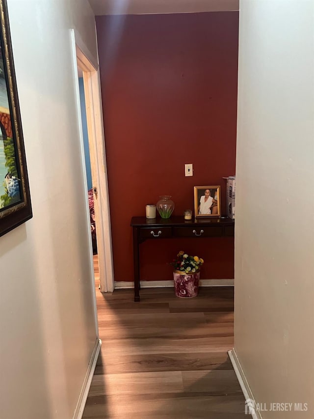 hallway featuring hardwood / wood-style flooring