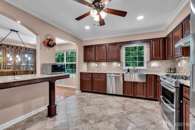 230 New Rd, South Brunswick, NJ 08852 - kitchen featuring stainless steel appliances, a ceiling fan, healthy amount of natural light, tasteful backsplash, and crown molding