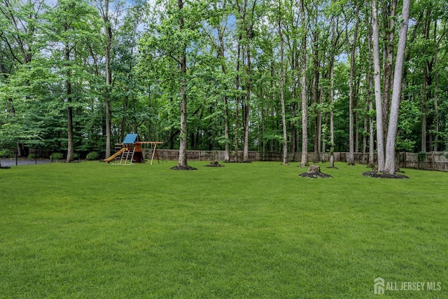 230 New Rd, South Brunswick, NJ 08852 - fenced backyard featuring a playground