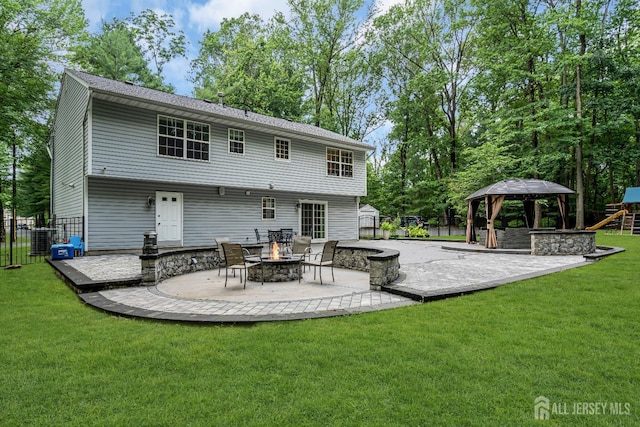 230 New Rd, South Brunswick, NJ 08852 - rear view of property with a gazebo, an outdoor fire pit, a patio, a shed, and a playground