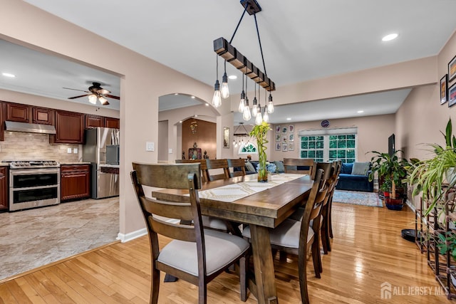230 New Rd, South Brunswick, NJ 08852 - dining room with light wood-type flooring, arched walkways, a ceiling fan, and recessed lighting