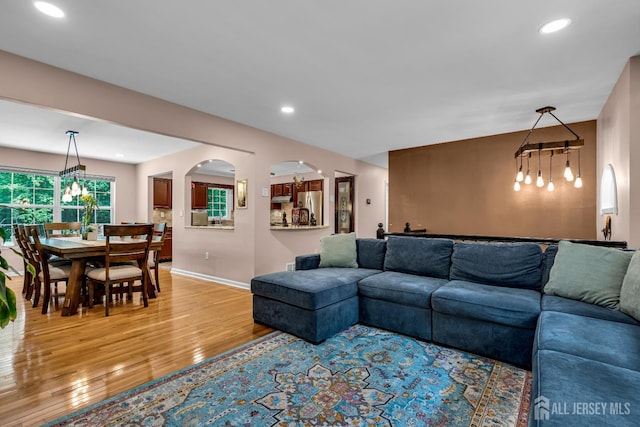 230 New Rd, South Brunswick, NJ 08852 - living room featuring light wood finished floors, recessed lighting, and arched walkways