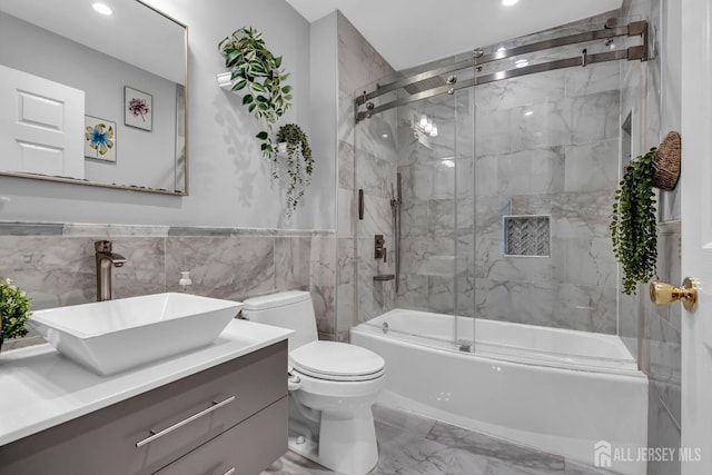 230 New Rd, South Brunswick, NJ 08852 - bathroom featuring marble finish flooring, enclosed tub / shower combo, vanity, tile walls, and recessed lighting