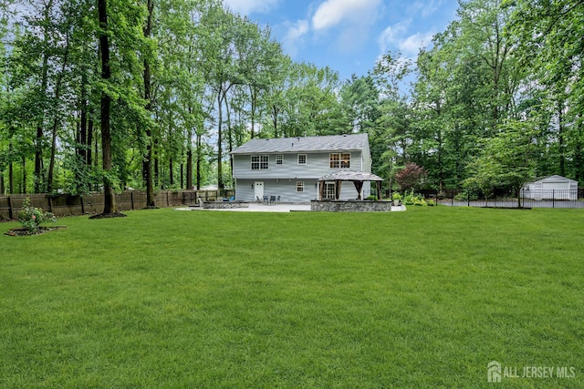 230 New Rd, South Brunswick, NJ 08852 - rear view of house featuring a patio area and a fenced backyard
