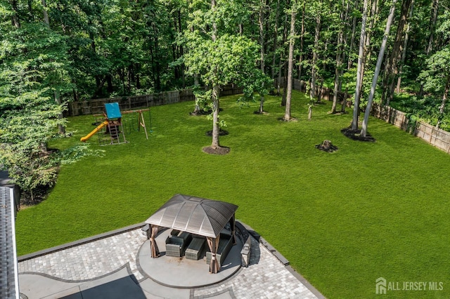 230 New Rd, South Brunswick, NJ 08852 - fenced backyard featuring a playground, a gazebo, and a patio area