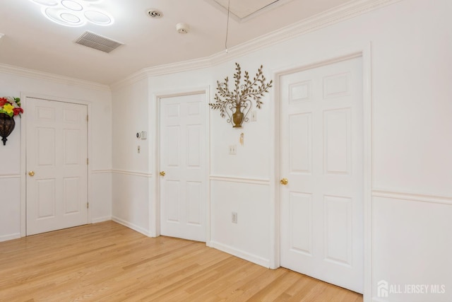 63 Clinton Ave, Keasbey, NJ 08832 - entryway featuring light wood-style floors and crown molding