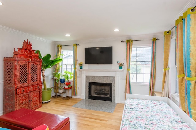 63 Clinton Ave, Keasbey, NJ 08832 - living area featuring ornamental molding, wood finished floors, a fireplace with flush hearth, and recessed lighting