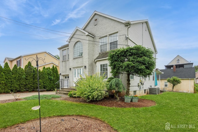 63 Clinton Ave, Keasbey, NJ 08832 - view of front facade with a front lawn