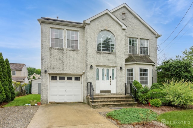 63 Clinton Ave, Keasbey, NJ 08832 - traditional-style home featuring an attached garage and concrete driveway