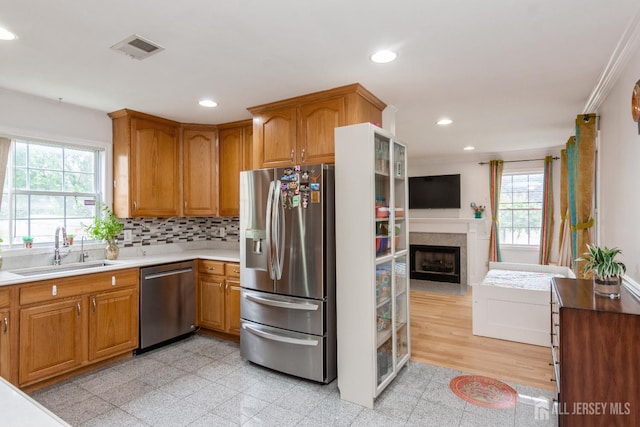 63 Clinton Ave, Keasbey, NJ 08832 - kitchen featuring stainless steel appliances, recessed lighting, granite tiled floors, a fireplace with flush hearth, and tasteful backsplash
