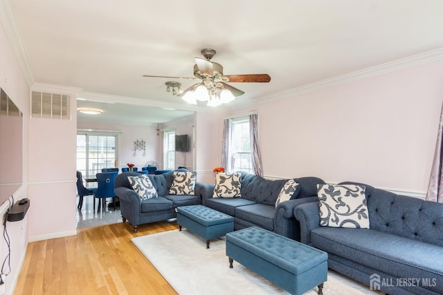 63 Clinton Ave, Keasbey, NJ 08832 - living area featuring ornamental molding, light wood finished floors, and a ceiling fan