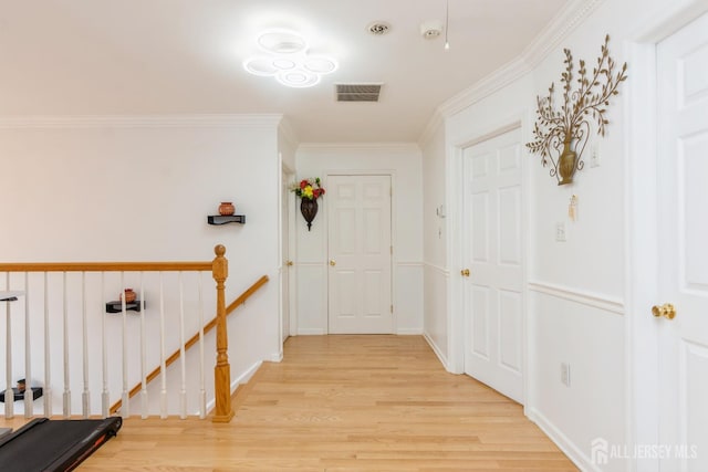 63 Clinton Ave, Keasbey, NJ 08832 - corridor with an upstairs landing, light wood-style flooring, and ornamental molding