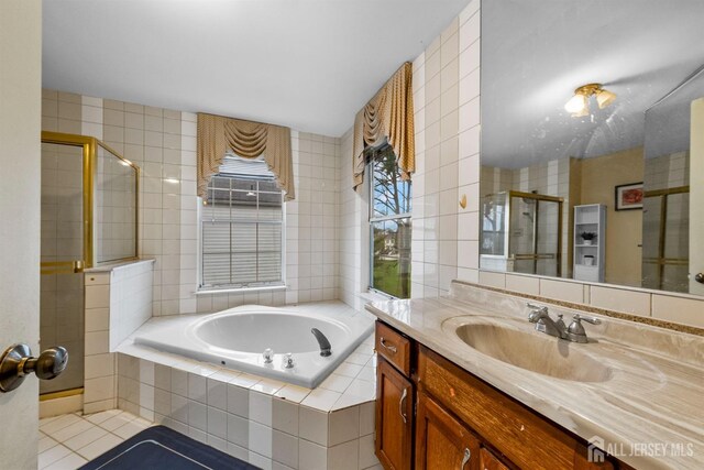 8 Carlisle Ct, Old Bridge, NJ 08857 - bathroom featuring vanity, a garden tub, a stall shower, and tile patterned flooring