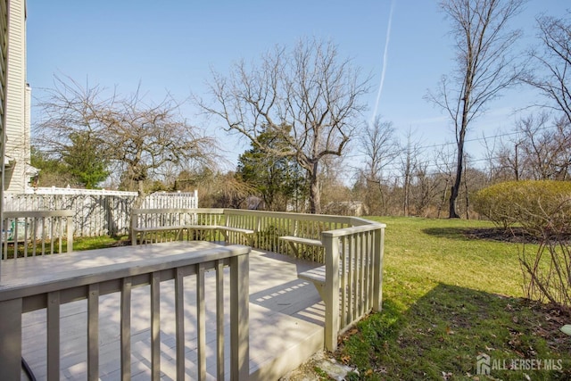 wooden deck with a yard