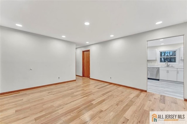 440 E Ave, Sewaren, NJ 07077 - unfurnished living room with light wood-type flooring and recessed lighting