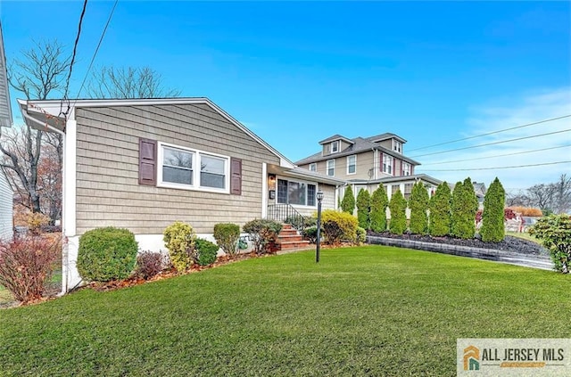 440 E Ave, Sewaren, NJ 07077 - view of front of home with a front lawn