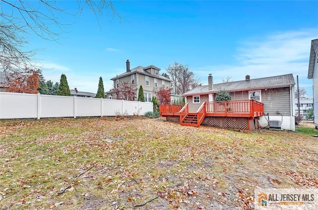 440 E Ave, Sewaren, NJ 07077 - rear view of house featuring a deck and a chimney