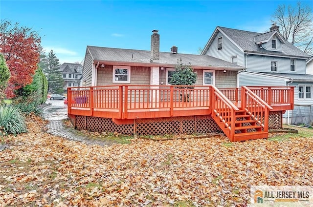 440 E Ave, Sewaren, NJ 07077 - rear view of property featuring a chimney and a wooden deck