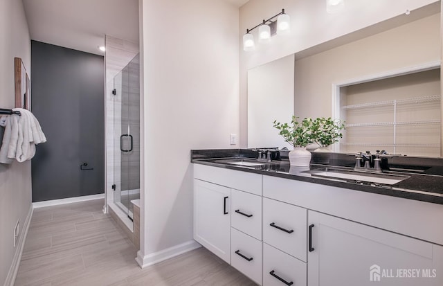 1314 Parker Blvd, West Windsor, NJ 08550 - bathroom featuring double vanity, baseboards, and a shower stall